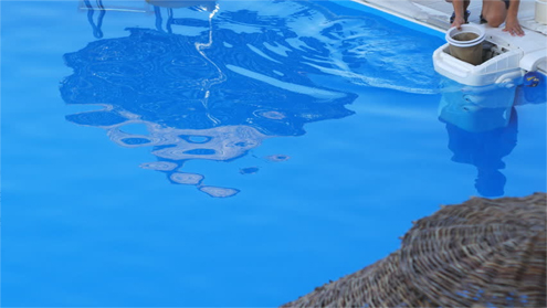 blue-pool-guy-cleaning-pool-filter